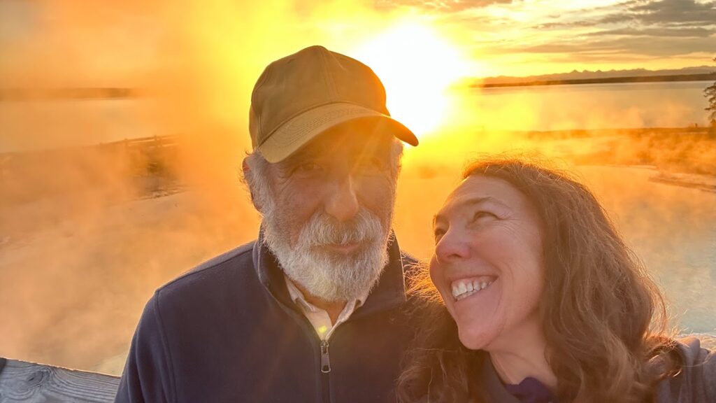 couple with sunrise smiling